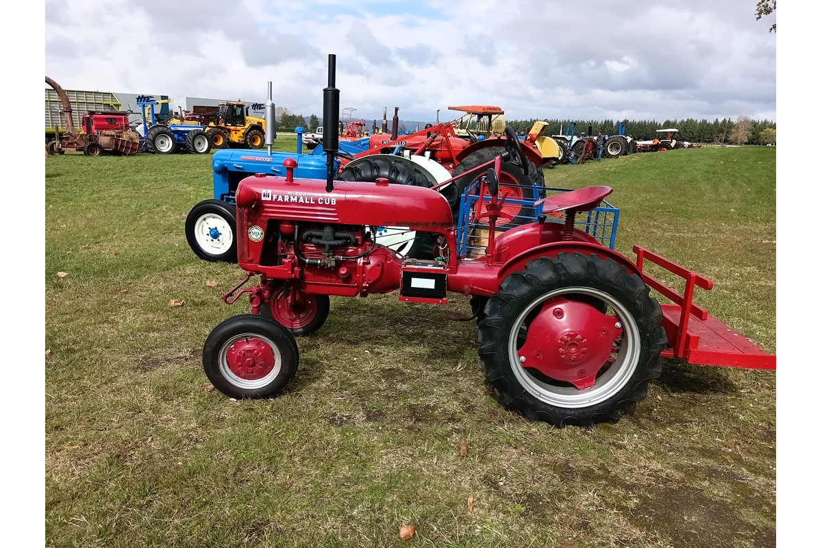 Line up of vintage tractors, in foreground is 1950's Farmall Cub
